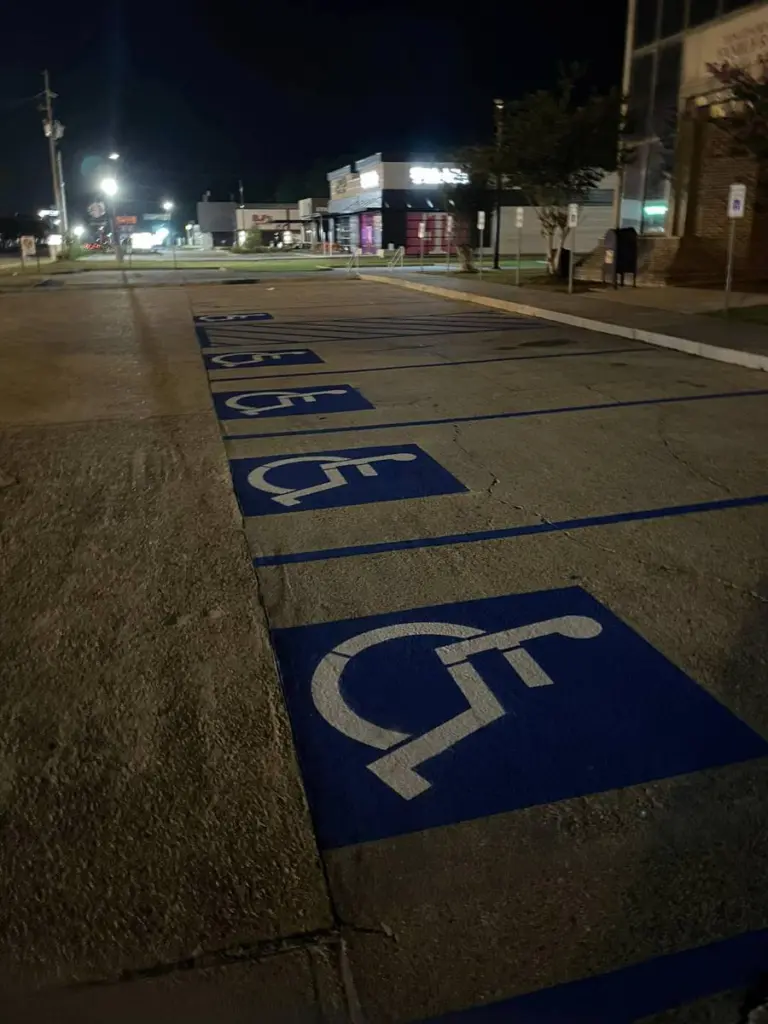 Accessible parking stalls freshly striped at night